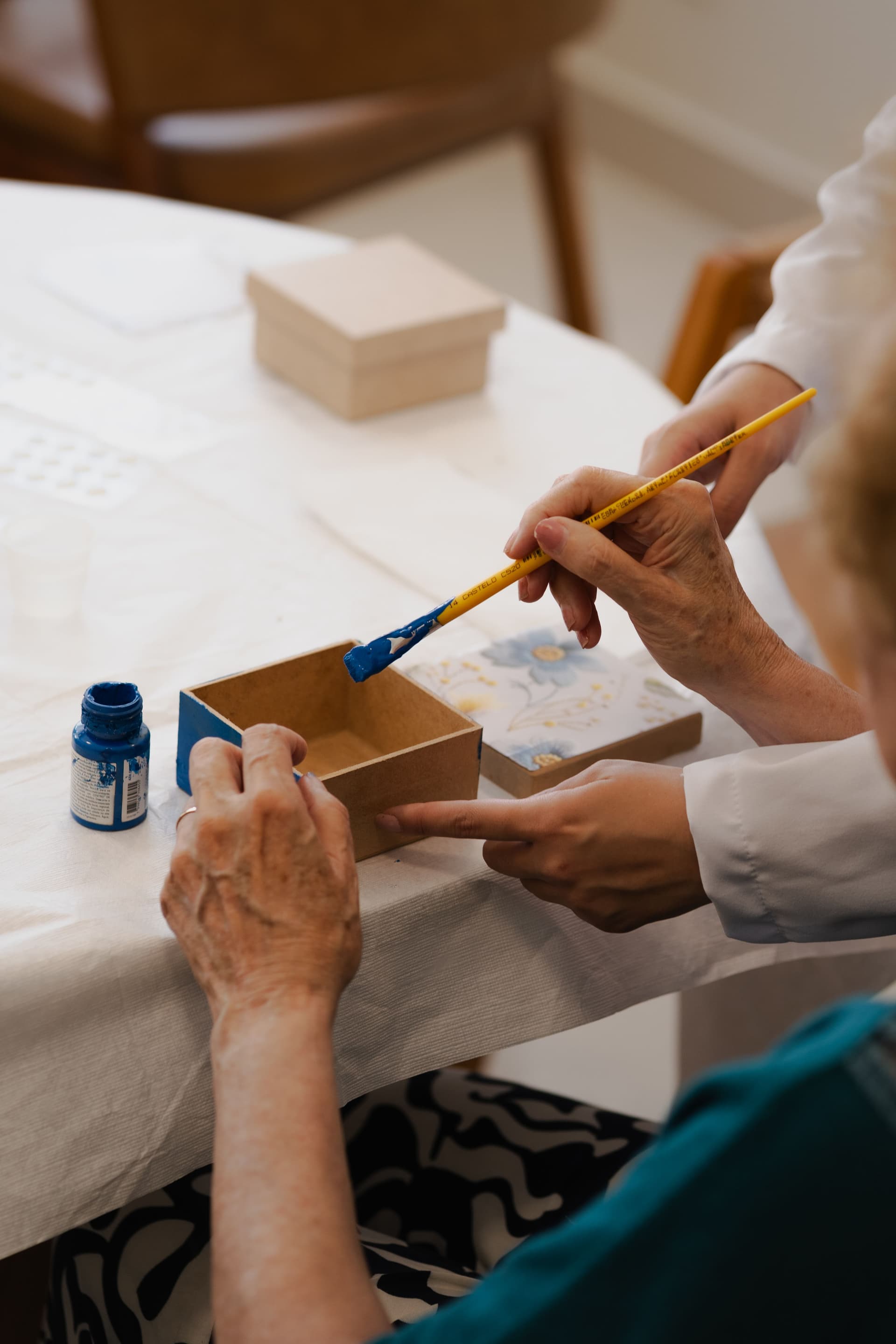Care worker supporting an older person
